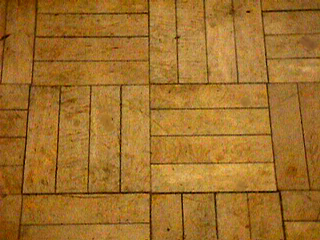 A close-up of our wood parque flooring.